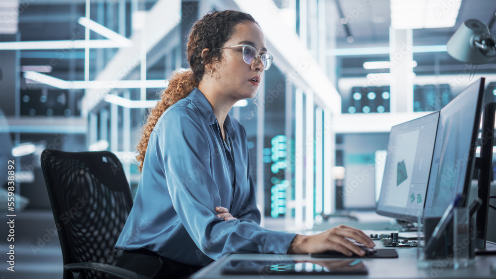 Happy Multiethnic Female Industrial Engineer Developing 3D Model of a Circuit Motherboard on Compute