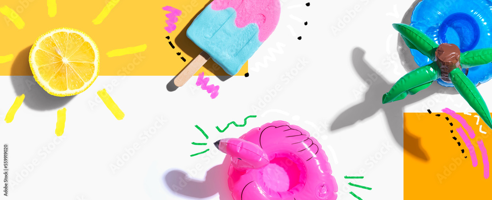 Summer concept with a flamingo float, lemon sunlight and a popsicle - flat lay