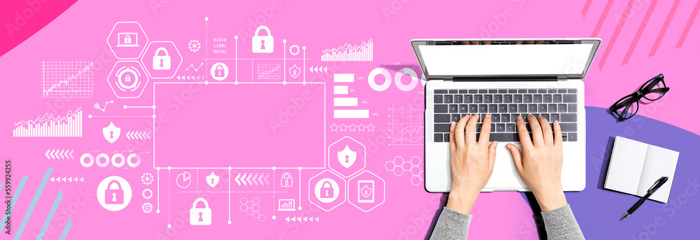 Cyber security theme with person using a laptop computer