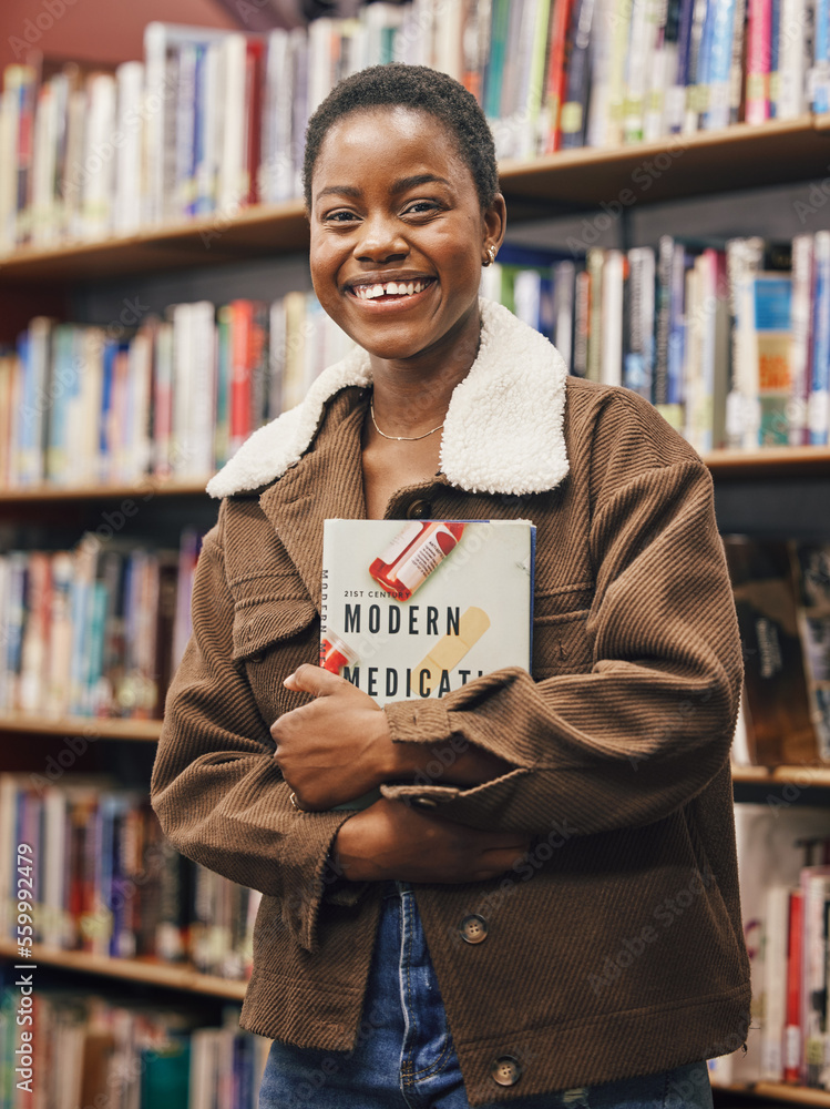 Black woman student, portrait and library with book, research or medical education with smile. Afric