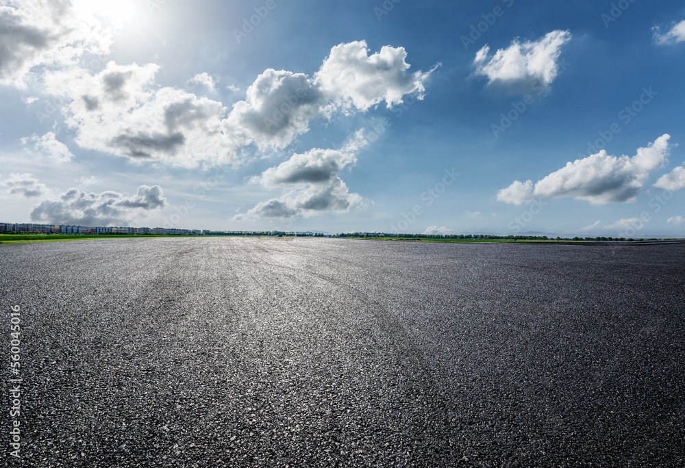 Asphalt road and sky clouds background