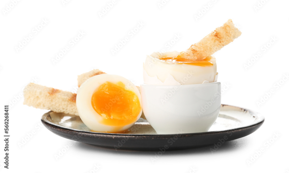 Plate with soft boiled eggs and toasted bread on white background