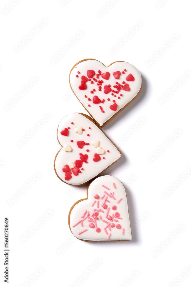 Tasty heart shaped cookies with colorful sprinkles on white background. Valentines Day celebration