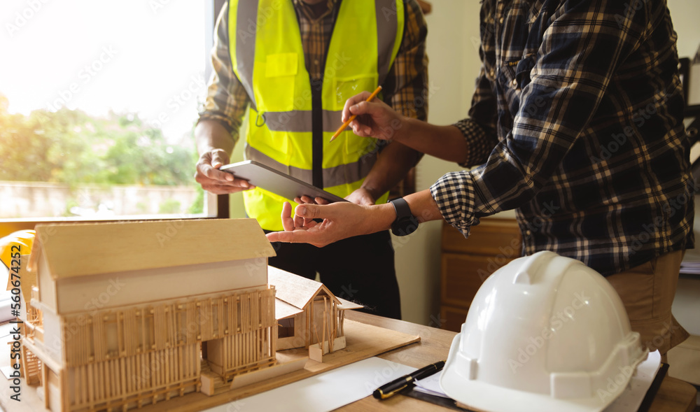 Engineer meeting for architectural project or architecture discussing and working on blueprint with 