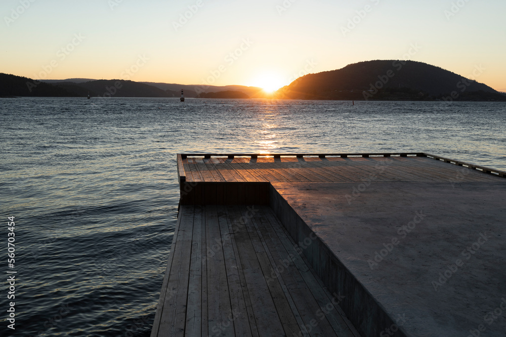 Wooden Jetty towards the sunset in Drobak, Norway