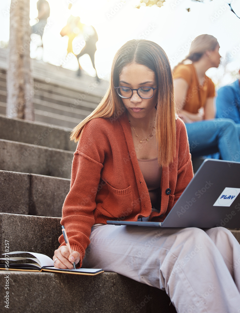 University, woman on stairs with laptop writing in notebook for school project with focus and motiva