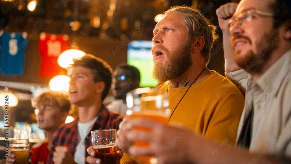 Group of Good Friends Enjoying Their Time in a Sports Pub. Three Men Cheering for Their Favorite Soc