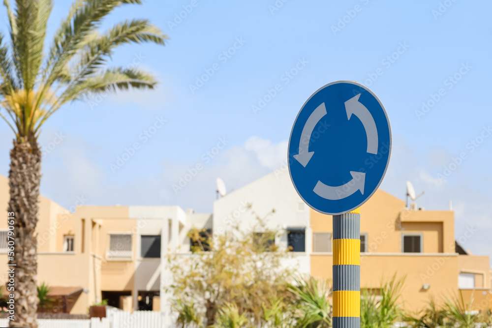 Circular motion sign on city street, closeup