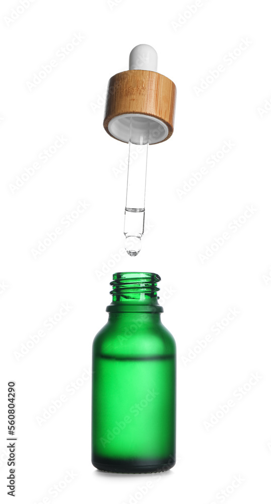 Dripping of healthy serum into bottle on white background