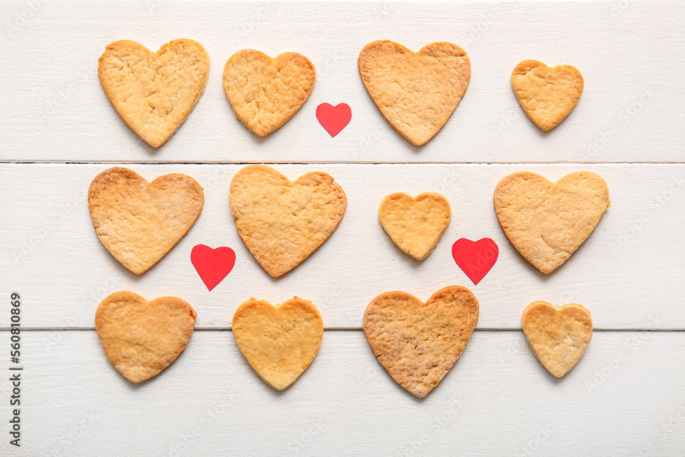 Composition with sweet heart shaped cookies on light wooden background. Valentines Day celebration