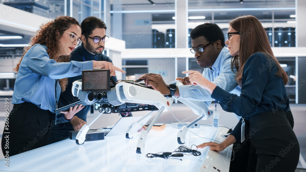 Portrait of a Young Team of Multicultural Engineers Use Computers, Connect Microchips, Analyze and D