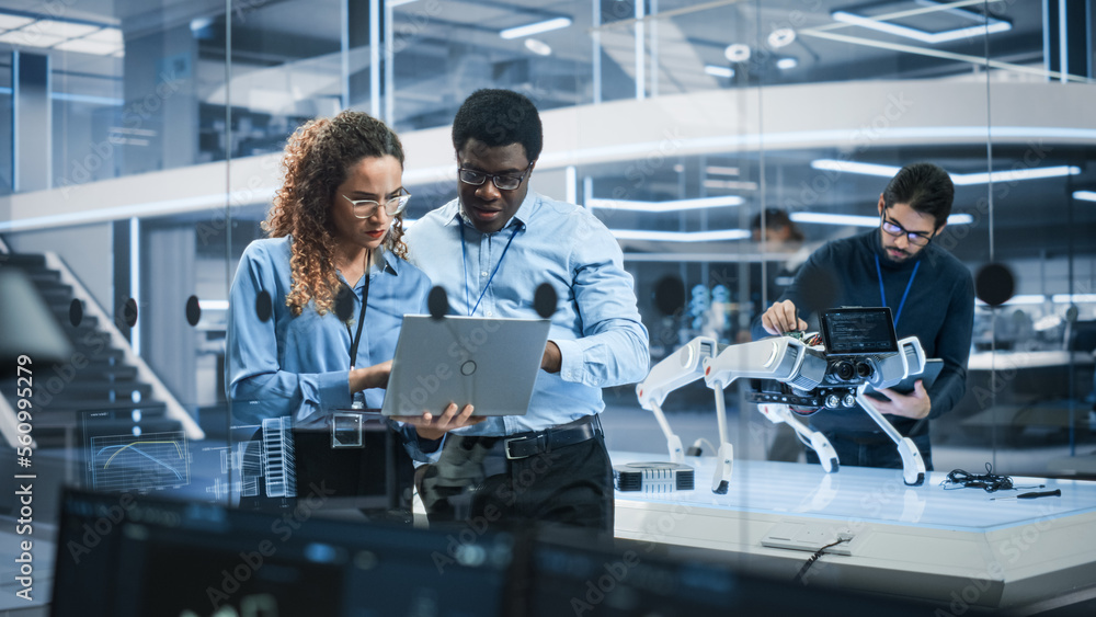 Portrait of Two Multiethnic Female and Male Engineers Use Laptop Computer to Connect, Analyze and Di