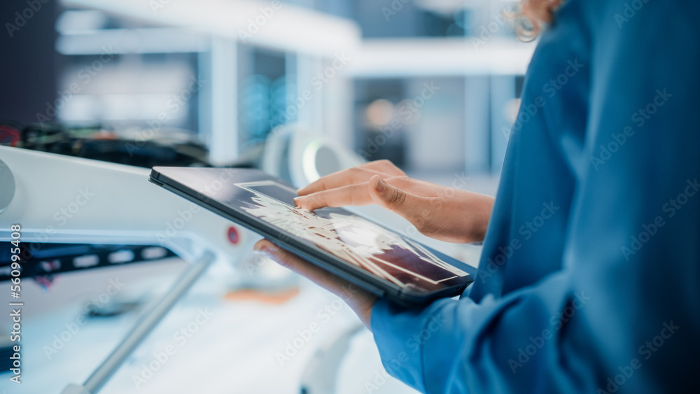 Close Up Footage of a Woman Using Tablet Computer in High Tech Modern Industrial Office Facility. En