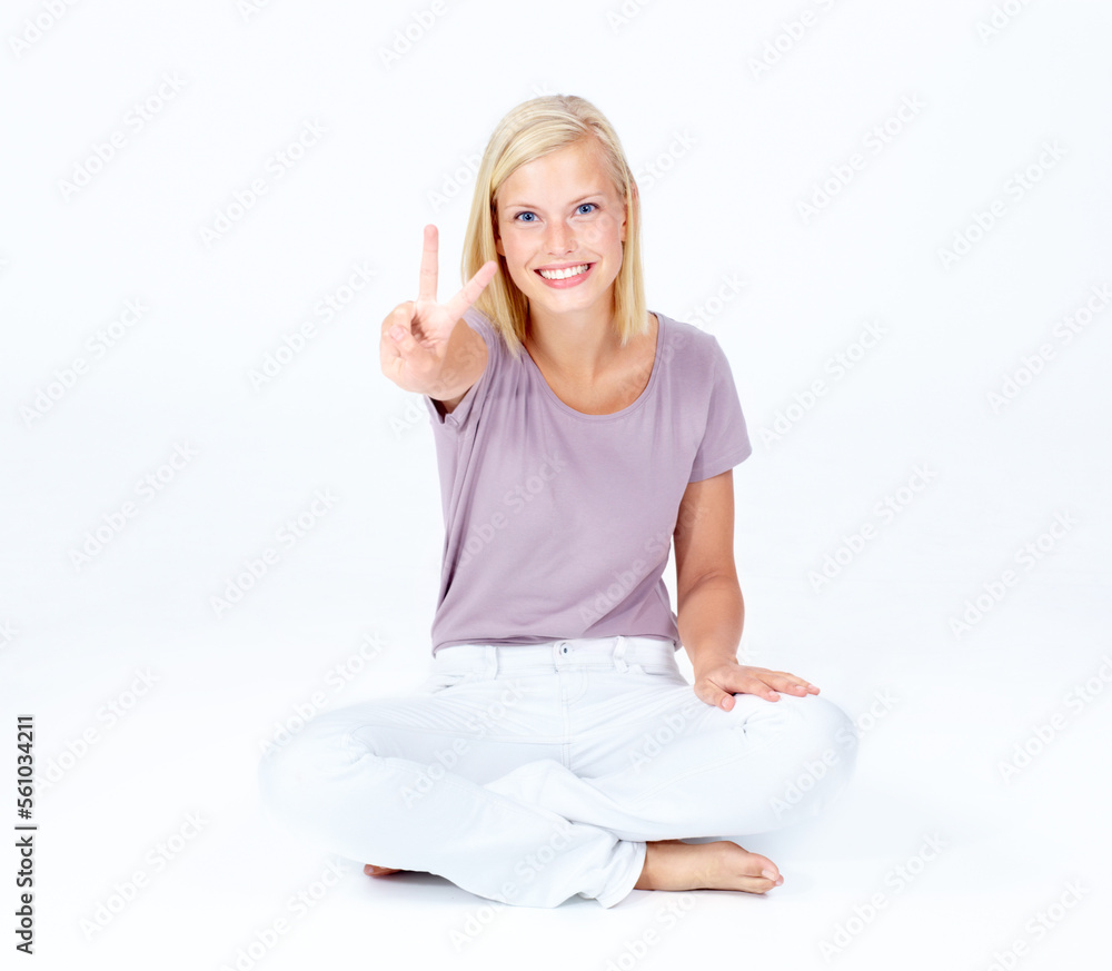 Happy woman, portrait or peace sign for good luck, positive energy or sitting optimism on white stud