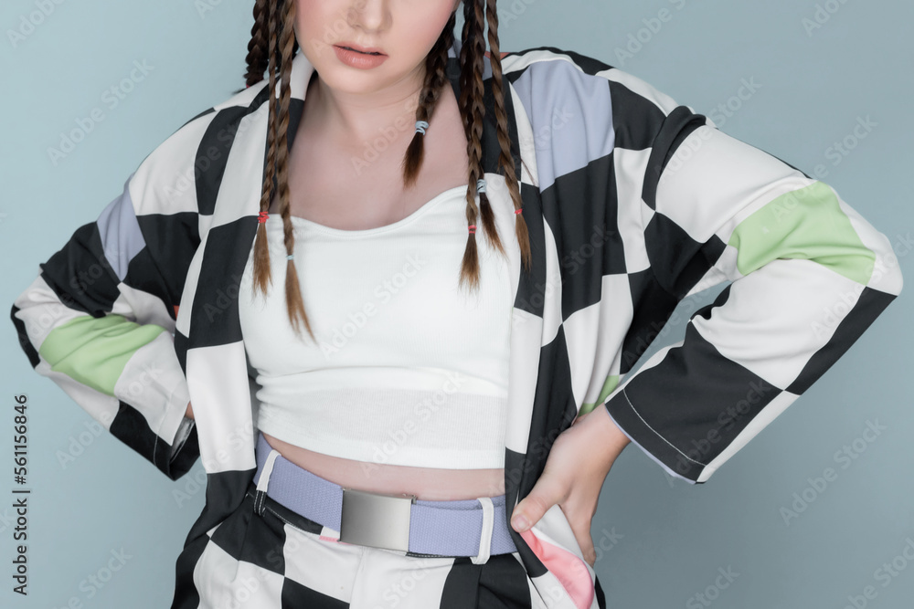 Closeup beautiful young girl with perfect skin, cosmetic and long braid posing with trendy fashion o