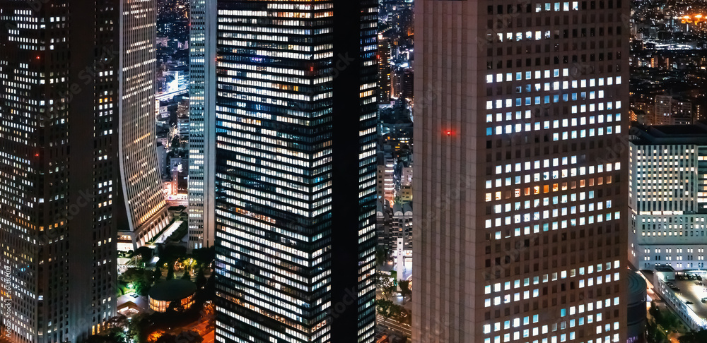 Skyscrapers towering above the night cityscape of Nishi-Shinjuku, Tokyo, Japan