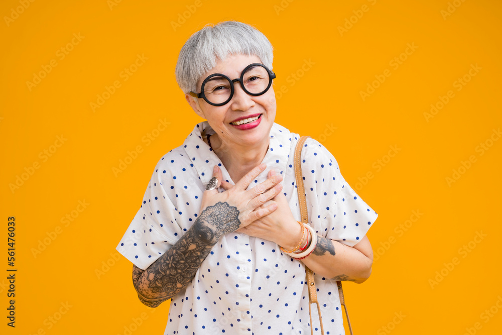 cheerful smiling asian senior woman wear glasses grey hair in casual cloth portrait headshot on yell