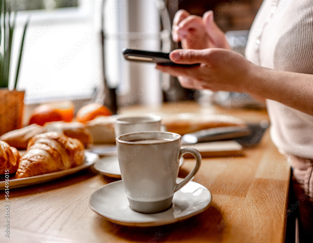 Girl preparing coffee cappuccino for breakfast