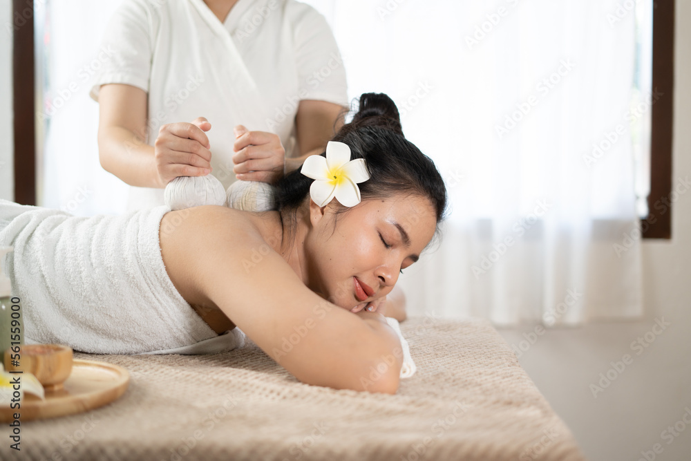 Young Asian beauty woman enjoying massage and spa.