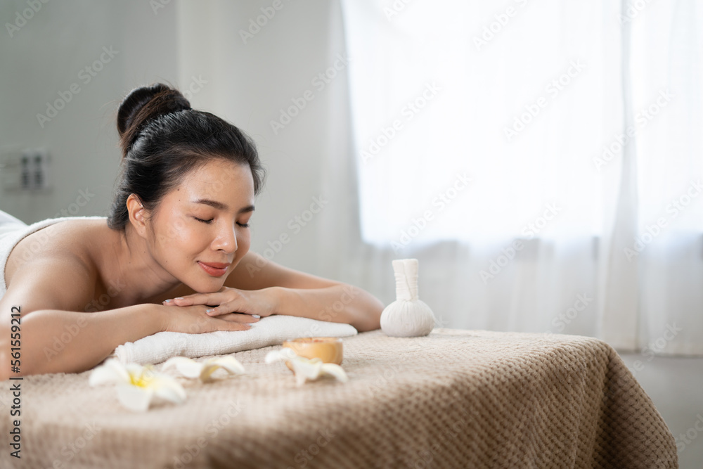 Young Asian beauty woman enjoying massage and spa.