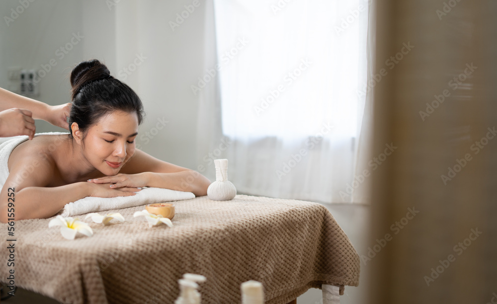 Young Asian beauty woman enjoying massage and spa.