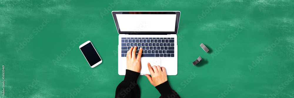 Person using a laptop computer from above