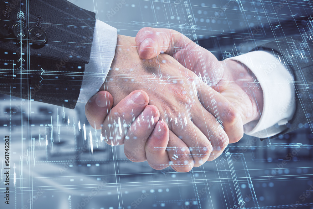 Close up of handshake with glowing candlestick forex grid chart on blurry office interior background