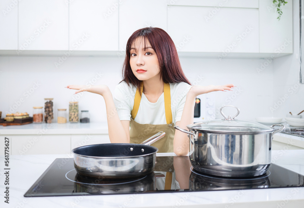 Image of young Asian woman in the kitchen