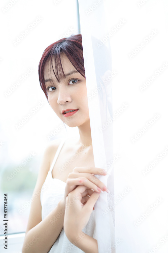 Beauty image of young Asian woman at home in the morning