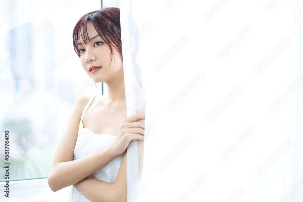 Beauty image of young Asian woman at home in the morning