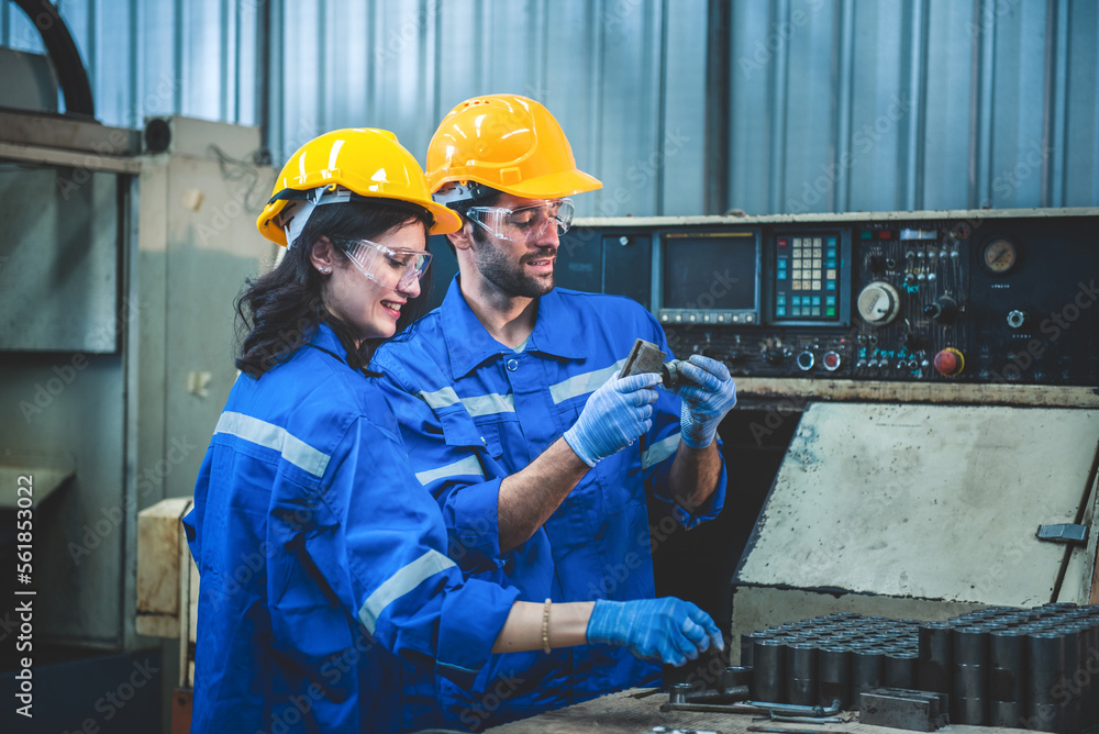 Portrait of Heavy industry workers working on the metal fabrication process by operating a lathe at 