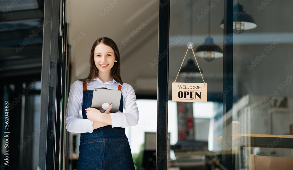 Startup successful small business owner sme woman stand with tablet and chart in cafe restaurant. wo