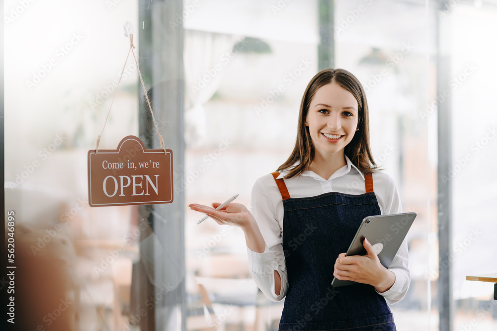 Startup successful small business owner sme woman stand with tablet  in cafe restaurant. .