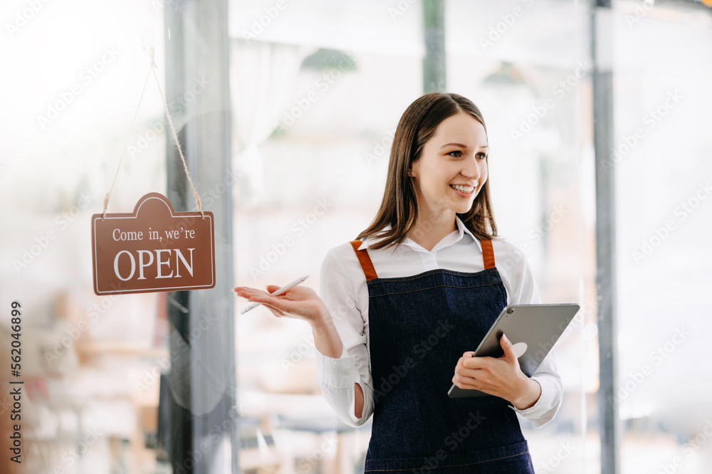 Startup successful small business owner sme woman stand with tablet  in cafe restaurant. .