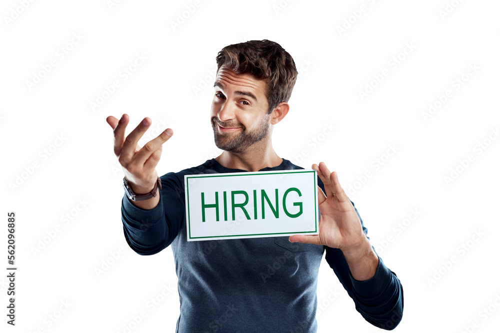 A handsome young man holding a hiring sign isolated on a PNG background.