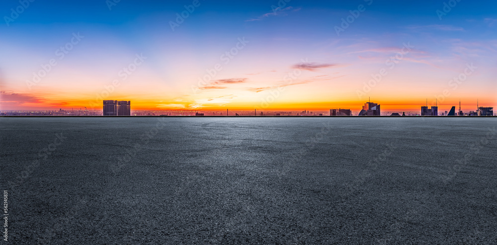 Asphalt road and city skyline with modern buildings in Shanghai at sunrise, China. Panoramic view.