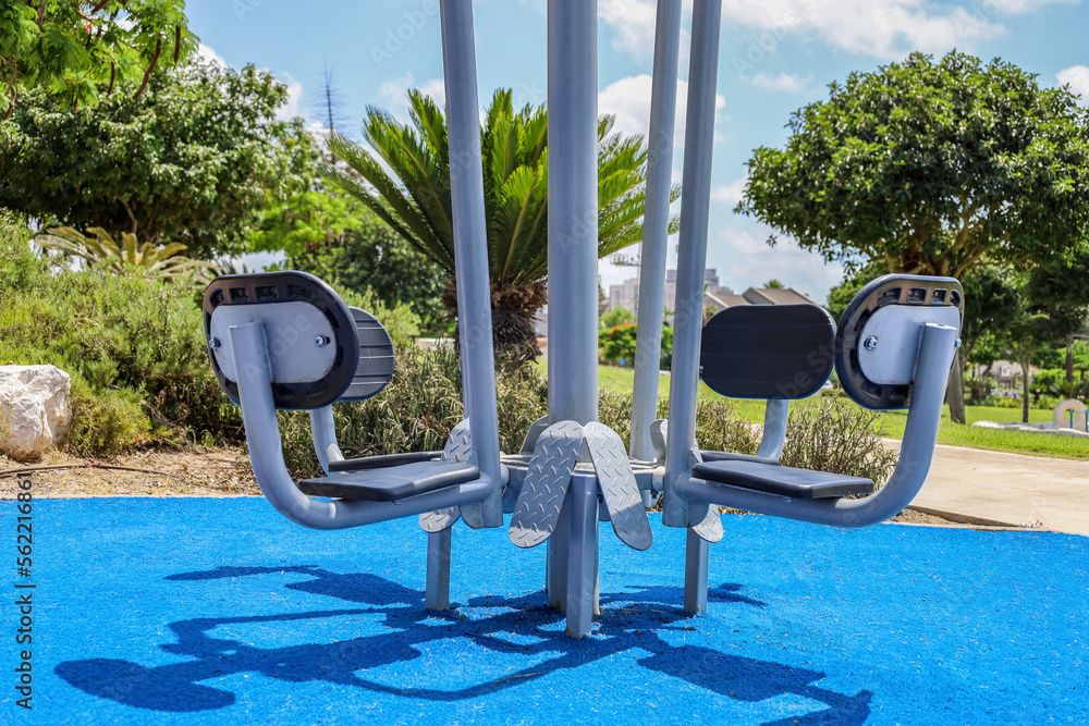 Modern exercise equipment on sport ground in city