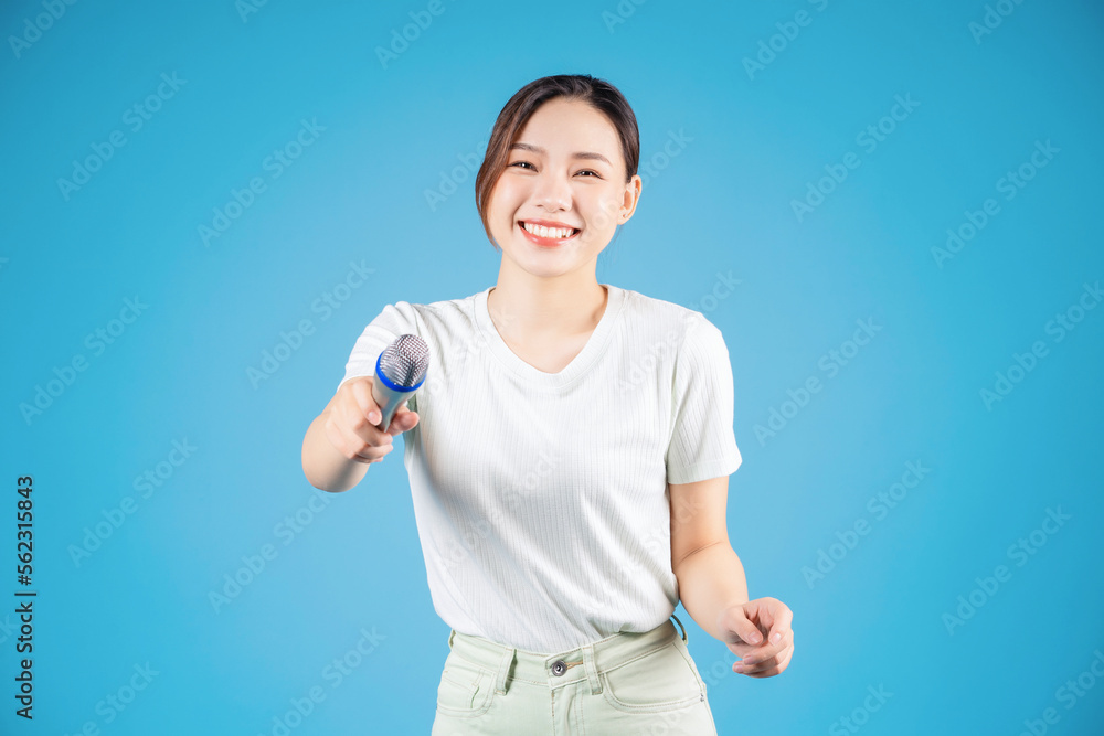 Portrait of young Asian woman singing