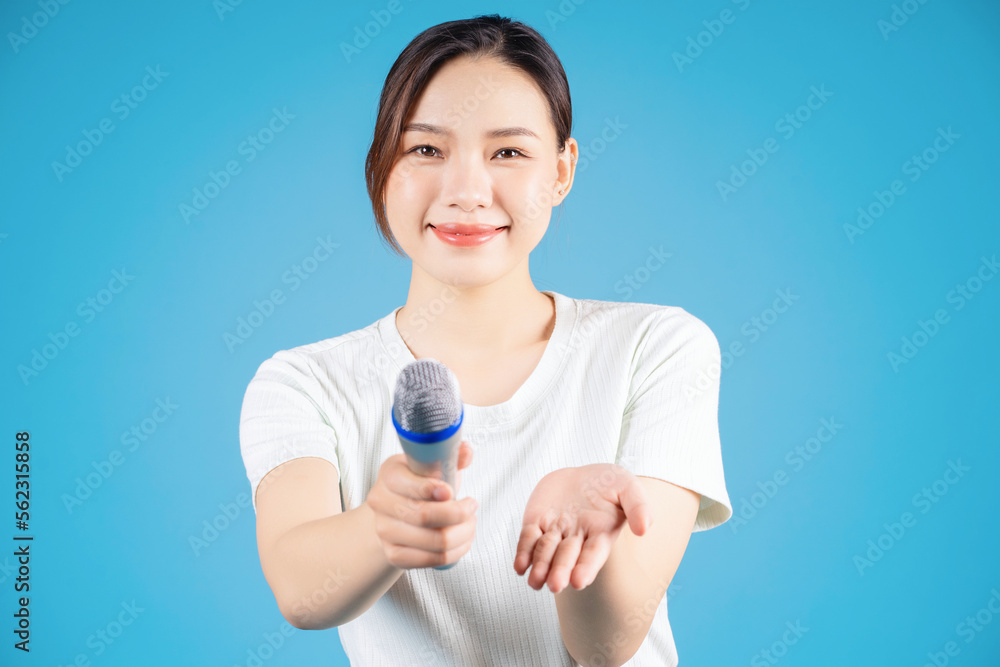 Portrait of young Asian woman singing