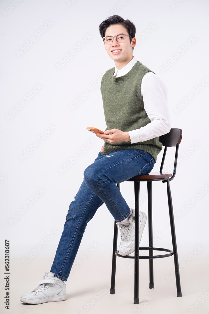 Image of young Asian man on white background