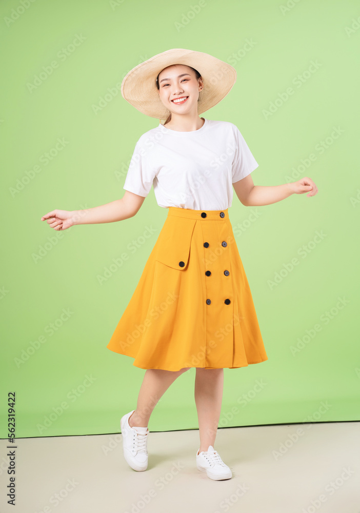 full length image of young Asian woman on background