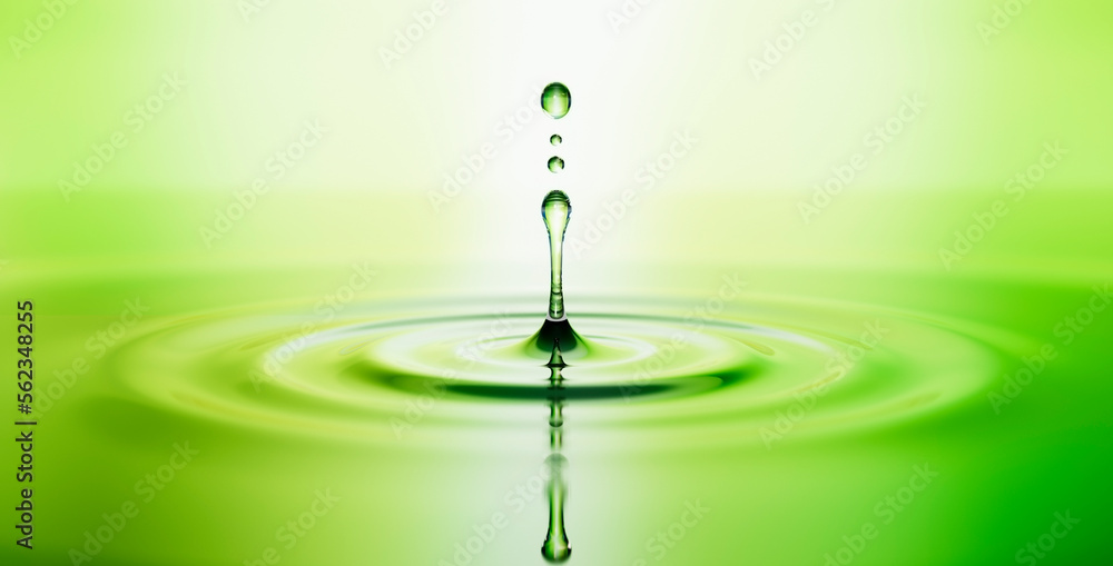 Water drop on water surface with ripples and green reflection - 3D illustration