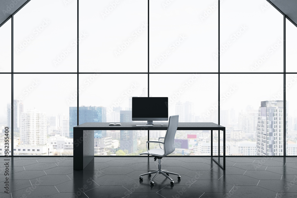 Front view on stylish black workspace table with modern computer and office chair on dark glossy pol