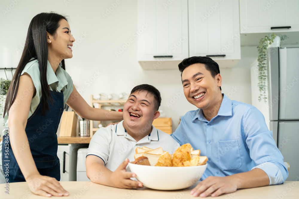 Asian happy family, mature parents baking bakery with son in kitchen