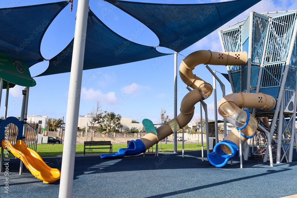 View of childrens playground with slide on sunny day