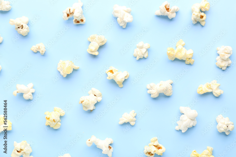 Delicious popcorn on blue background