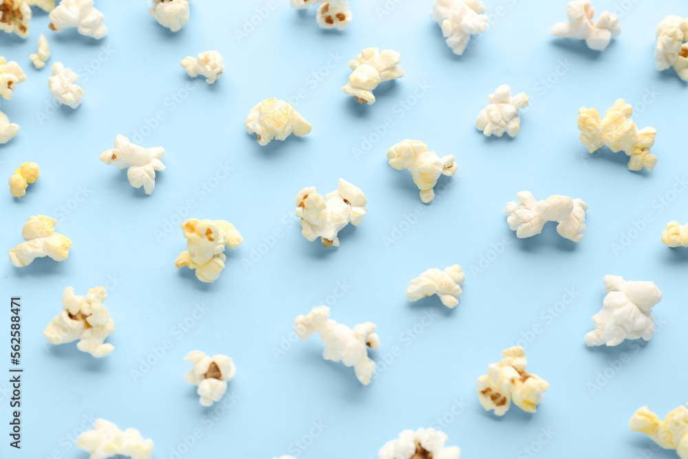 Delicious popcorn on blue background