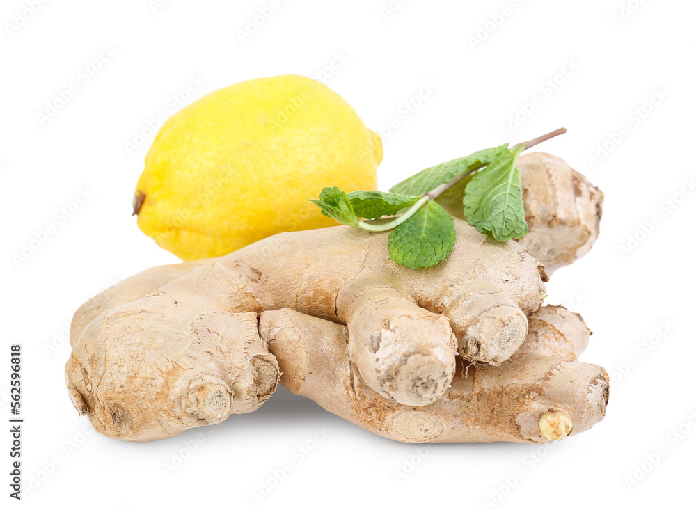 Fresh ginger roots and lemon on white background