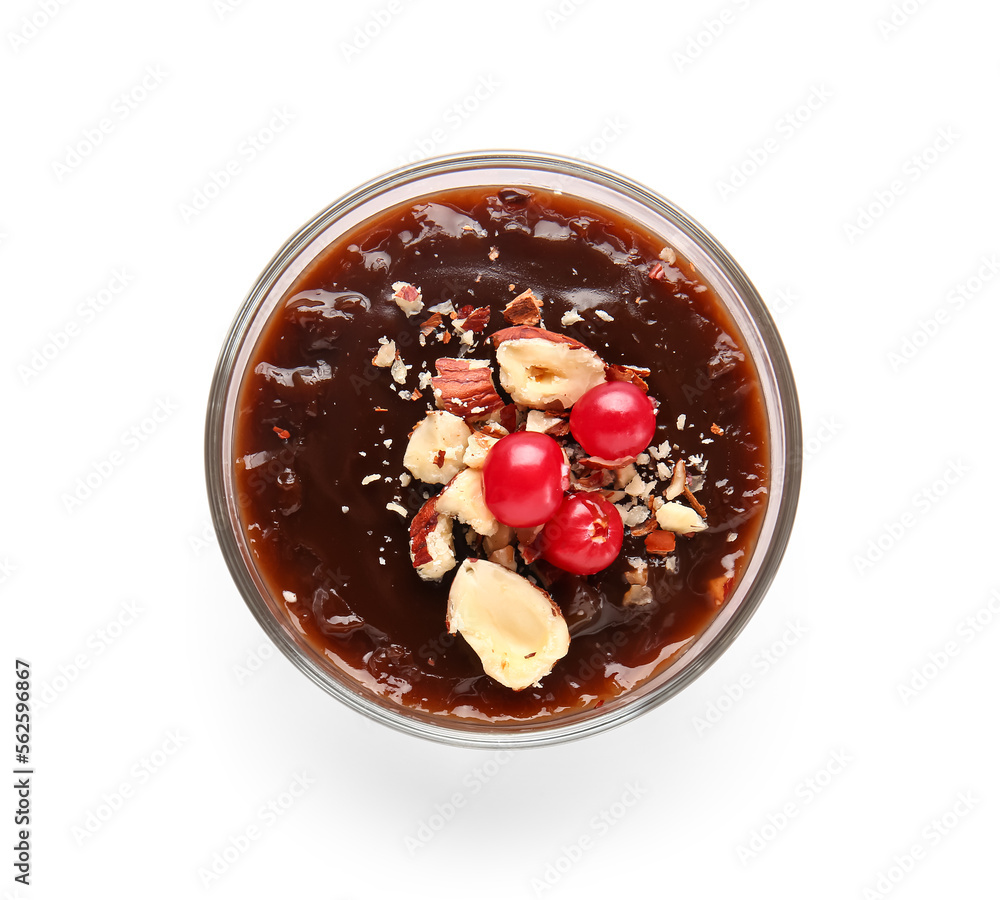 Glass of delicious chocolate pudding with cranberry and almond isolated on white background