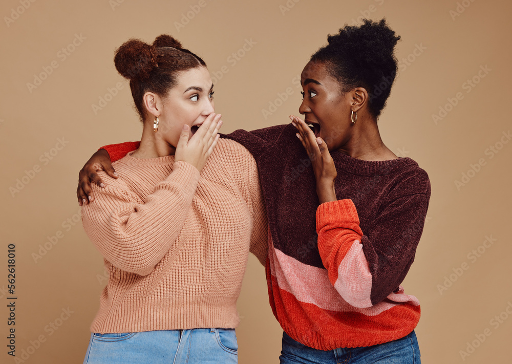 Gossip, friends and surprise face of young women with a secret and brown studio background. Wow, stu